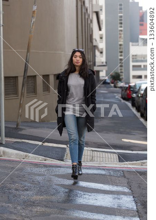 Beautiful woman walking in the street 133604892