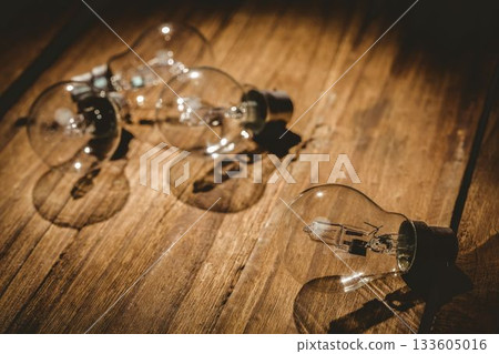 Light bulbs on table on wooden table Light bulbs on table on wooden table 133605016