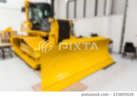Flat design is showing large yellow bulldozer sitting in warehouse with chairs and crates Flat design is showing large yellow bulldozer sitting in warehouse with chairs and crates 133605026
