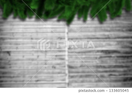 Blurred fir branches on wood Blurred fir branches on wood 133605045