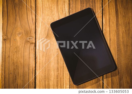 Overhead of tablet on desk 133605053