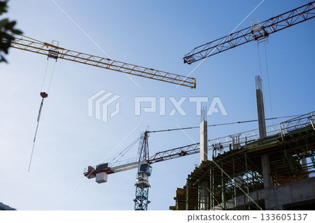 Crane and building construction site 133605137