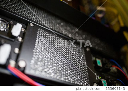 Honeycomb mesh panel is being shown in 3D render interior, featuring fans, power connectors, cables Honeycomb mesh panel is being shown in 3D render interior, featuring fans, power connectors, cables 133605143