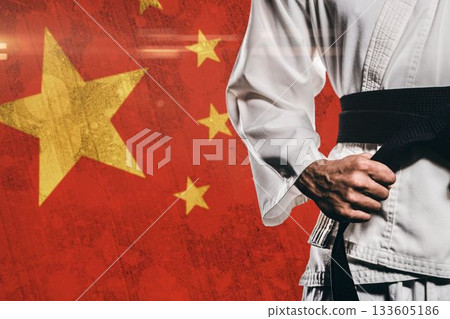 Midsection of martial artist against Chinese Flag Midsection of martial artist against Chinese Flag 133605186