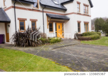 Facade of white house with driveway Facade of white house with driveway 133605367