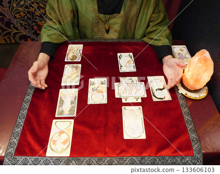 Man doing tarot reading Man doing tarot reading 133606103