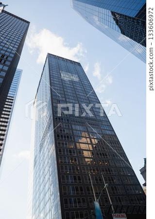 dark-glass grid office tower is standing in flat design scene with street-lamp and parking sign dark-glass grid office tower is standing in flat design scene with street-lamp and parking sign 133606972