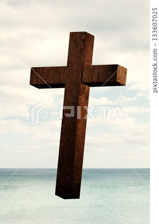 Wooden cross floating over calm turquoise sea under pale cloudy sky in flat design 133607025