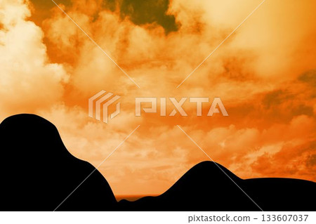 Flat design silhouette dunes are standing against glowing orange sky with scattered cloud shapes Flat design silhouette dunes are standing against glowing orange sky with scattered cloud shapes 133607037