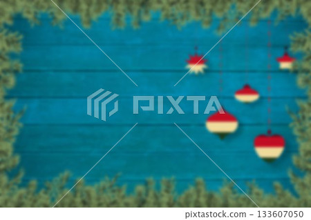 Blurred christmas decorations hanging over wood Blurred christmas decorations hanging over wood 133607050