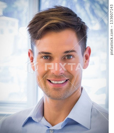 Casual businessman smiling Casual businessman smiling 133607143