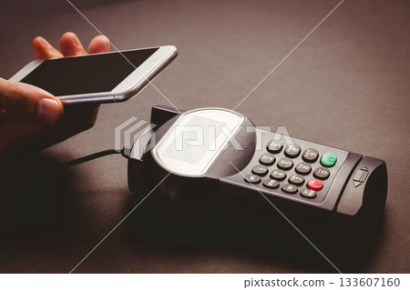 Man using smartphone to express pay 133607160