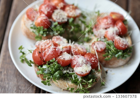 Cherry Tomato and Sprout Baguette Open Sandwich Cherry Tomato and Sprout Baguette Open Sandwich 133607378