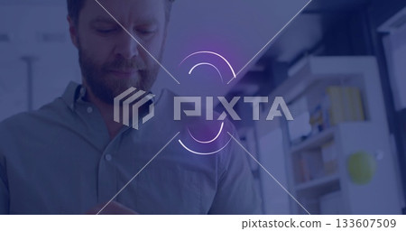 Checking adult man wearing collared shirt scrolling handheld device in office, with loading icons Checking adult man wearing collared shirt scrolling handheld device in office, with loading icons 133607509