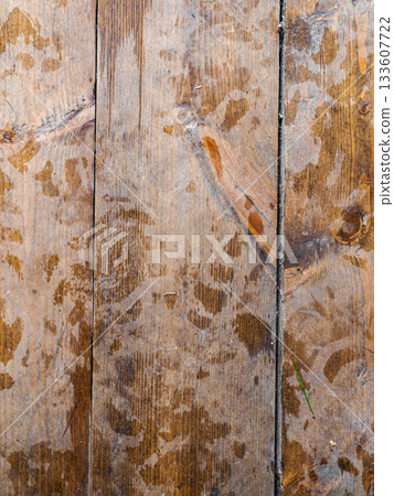 Planed floor boards with traces. Footprints on the wooden floor. 133607722