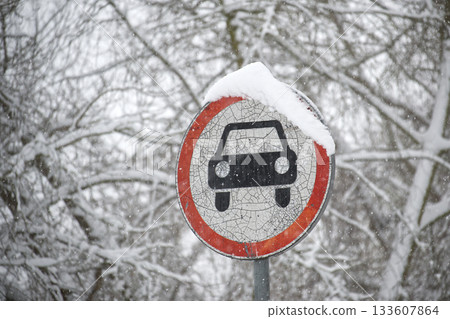 Winter Scene Of A Car Prohibition Sign Covered In Snow In A Frosty Forest Winter Scene Of A Car Prohibition Sign Covered In Snow In A Frosty Forest 133607864