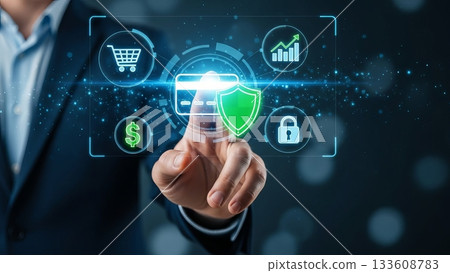 Businessman touching futuristic interface with credit card and green shield security icon 133608783