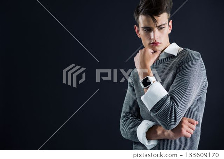Thoughtful man against black background Thoughtful man against black background 133609170
