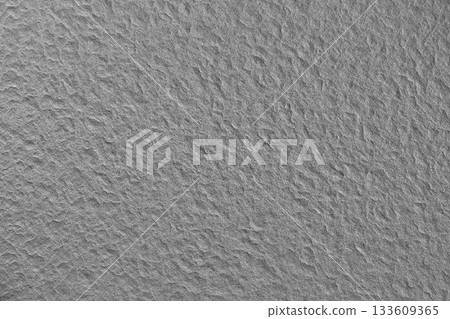 Flat design rough grey concrete texture is filling frame with irregular bumps and depressions Flat design rough grey concrete texture is filling frame with irregular bumps and depressions 133609365