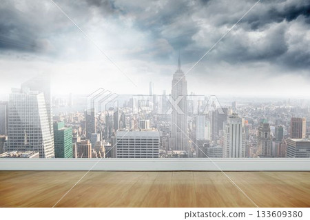 Flat interior is revealing wood floor and glass wall framing art-deco skyscraper under overcast sky Flat interior is revealing wood floor and glass wall framing art-deco skyscraper under overcast sky 133609380