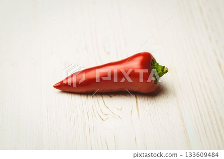 Red hot pepper on wooden table Red hot pepper on wooden table 133609484