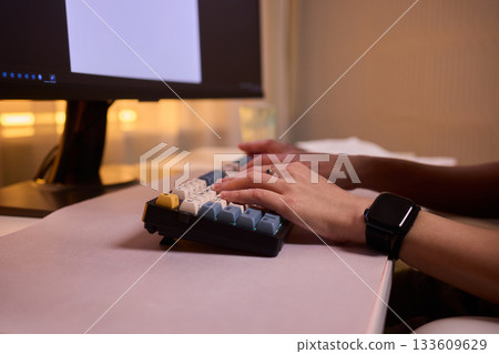 Typing on keypad with smartwatch, User engaging with numeric keypad and smartwatch, Focused individual performing data entry with compact devices in streamlined workspace Typing on keypad with smartwatch, User engaging with numeric keypad and smartwatch, Focused individual performing data entry with compact devices in streamlined workspace 133609629