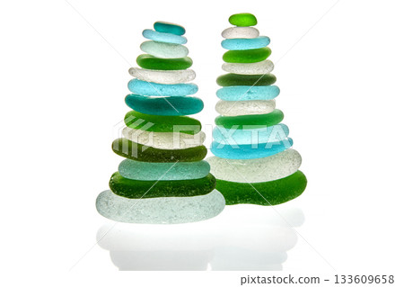 Sea polished glass shards arranged in a pyramid isolated on white background. 133609658