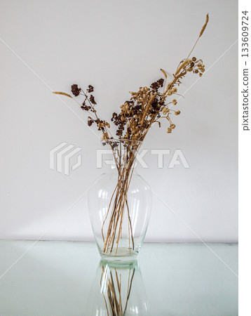 White still life with dry herbs and glass 133609724