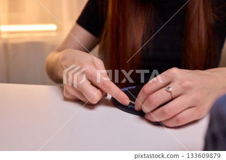 Crochet workshop scene, Artisan at work with yarn, Cozy crafting space with textured handmade stitches, Quiet studio environment dedicated to knitting and crochet crafts today 133609879