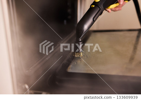 Steam tool purges baked grease, Focused steam device eliminates stubborn oven grime, Precise steam cleaning process handles tough residue from oven glass door effectively 133609939