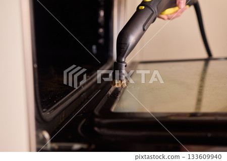 Steam tool purges baked grease, Focused steam device eliminates stubborn oven grime, Precise steam cleaning process handles tough residue from oven glass door effectively Steam tool purges baked grease, Focused steam device eliminates stubborn oven grime, Precise steam cleaning process handles tough residue from oven glass door effectively 133609940