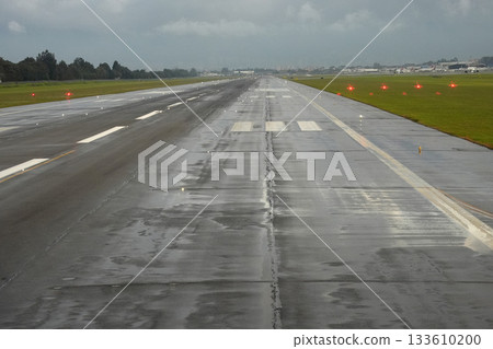 bogota airport landing and taking off strip under the rain 133610200