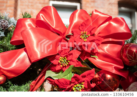 Christmas objects decorated with red bricks and red ribbons Christmas objects decorated with red bricks and red ribbons 133610456