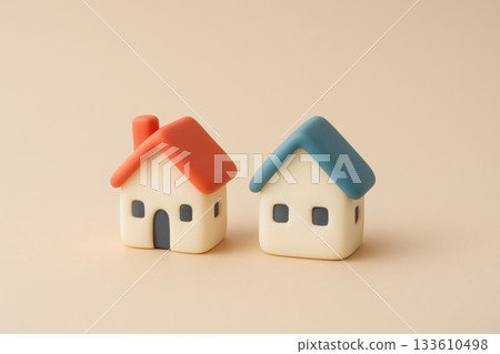 Cute miniature house models with red and blue roofs 133610498