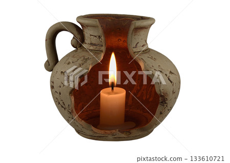 A beautifully crafted ceramic candle holder with an openwork design, showcasing a glowing candle inside A beautifully crafted ceramic candle holder with an openwork design, showcasing a glowing candle inside 133610721