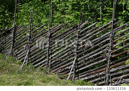 a rustic wooden fence constructed in a traditional Scandinavian style 133611316