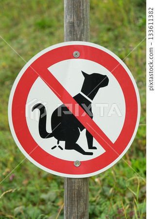 Red and white no dogs allowed sign in park. Red and white no dogs allowed sign in park. 133611382