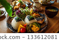 Enjoy a colorful Japanese lunch plate and healthy meal in a cafe surrounded by the warmth of wood and natural light. Enjoy a colorful Japanese lunch plate and healthy meal in a cafe surrounded by the warmth of wood and natural light. 133612081