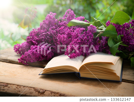 Lilac and book on the table Lilac and book on the table 133612147