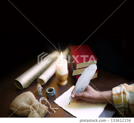 Man writing a letter on a desk Man writing a letter on a desk 133612156