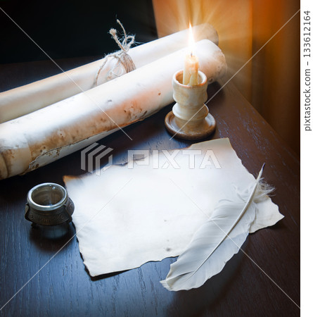 Paper and quill on the table 133612164