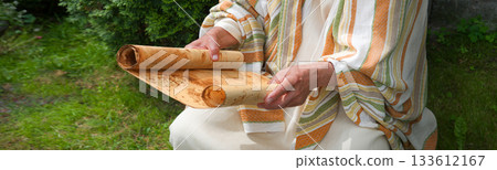 Old man reading the scroll Old man reading the scroll 133612167