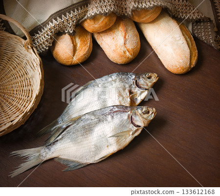 Bread and fish on the table Bread and fish on the table 133612168