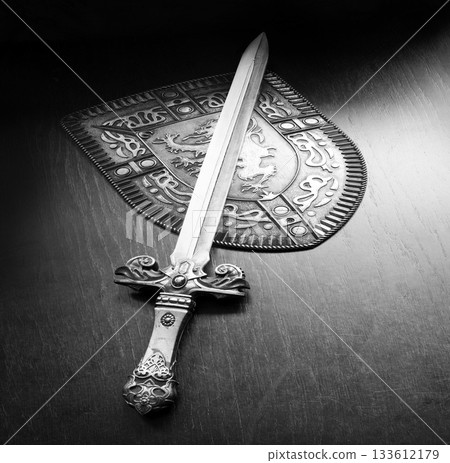 Iron shield and sword on the table Iron shield and sword on the table 133612179