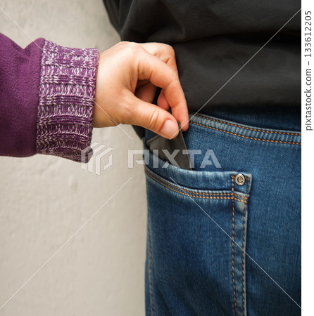 A hand takes money A hand takes money 133612205