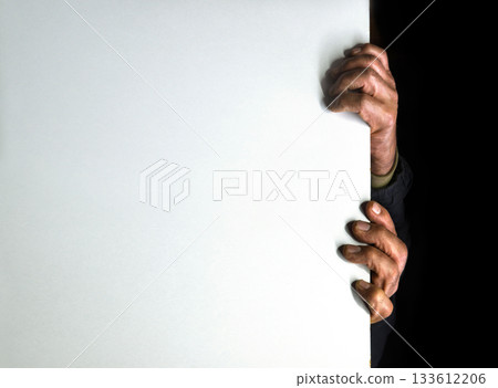 Old man hides after the wall Old man hides after the wall 133612206