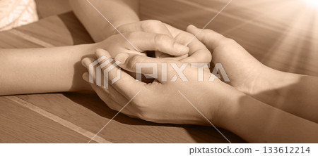 Close-up view of comforting hands Close-up view of comforting hands 133612214