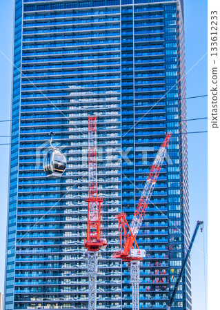 Yokohama cityscape, Japan, November 26. View of the ropeway in front of Sakuragicho Station and the crane in front of The Tower Yokohama Kitanaka. 133612233