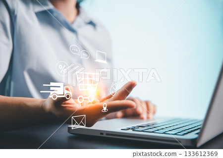 Concept of procurement technology shopper using computer or laptop for online shopping, e-commerce convenience with credit card payments, digital trolleys, fast delivery powered by modern technology. 133612369