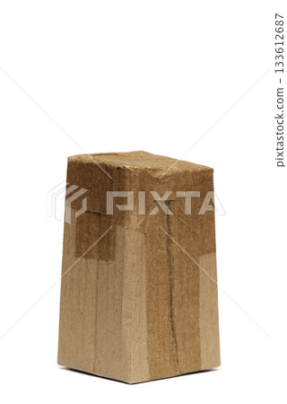 A small rectangular cardboard box wrapped in brown paper and sealed with tape A small rectangular cardboard box wrapped in brown paper and sealed with tape 133612687